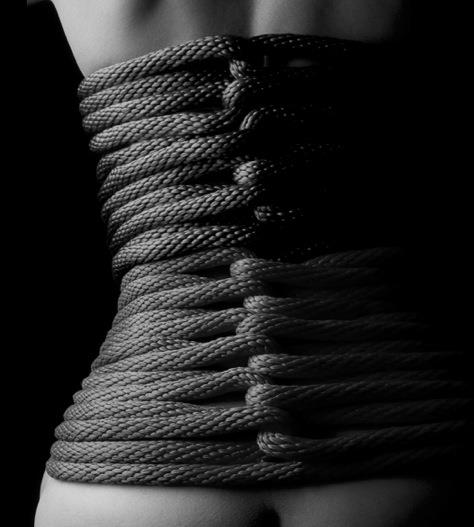 female submissive in rope corset