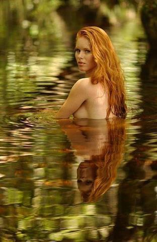 sexy redhead swimming naked