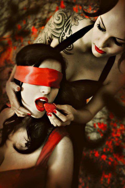 blindfolded female submissive domme feeding strawberries